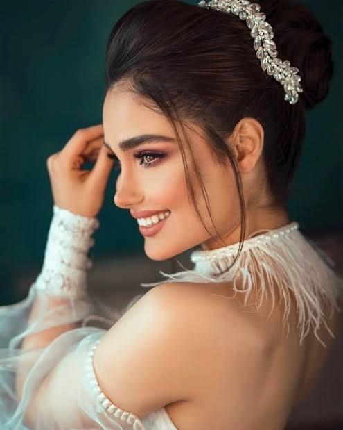 Bride with soft bridal lashes and an elegant updo on her wedding day